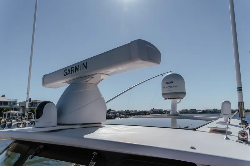 Slide: The Image of 2019 Grady-White Express 330 boat with Garmin radar and TracVision satellite system. - 18