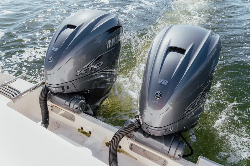 Slide: The Image of Twin Yamaha V8 outboard engines on a 2019 Grady-White Express 330 boat. - 11