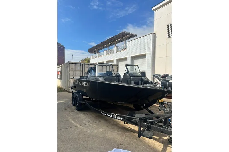 The Image of 2027 Tracker Targa V-18 Combo boat on trailer, parked outdoors. - 0