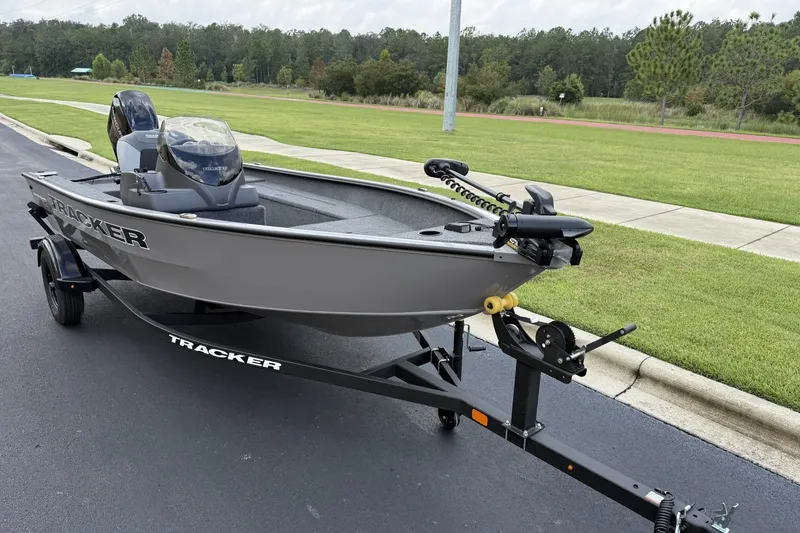 Slide: The Image of 2027 Tracker Bass Tracker 175 CC boat on trailer, parked on a road. - 36
