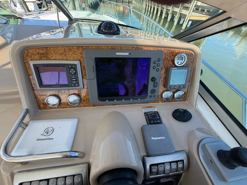 Slide: The Image of The cockpit of the 2009 Formula 34 Performance Cruiser features modern navigation equipment and controls. - 15
