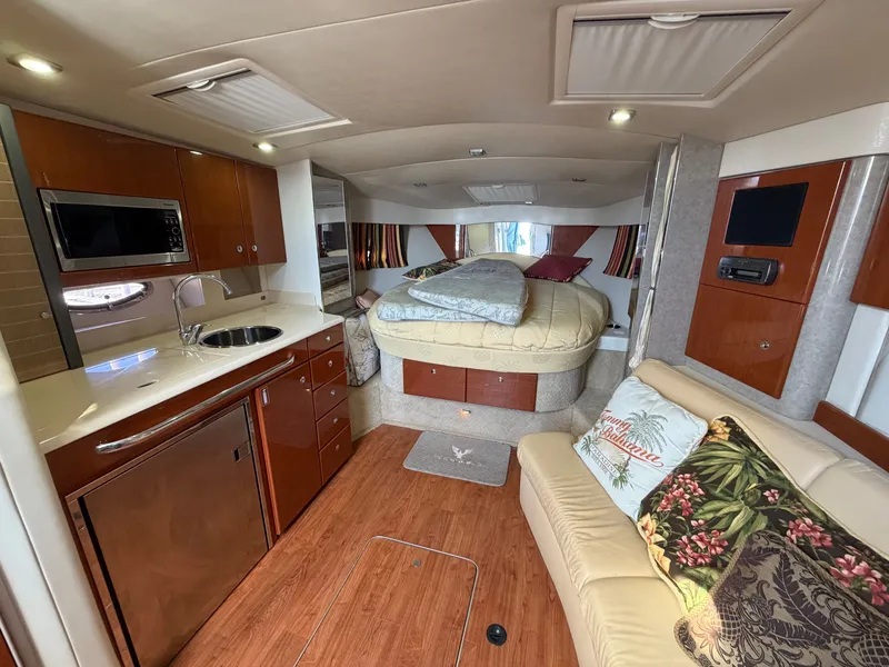 Slide: The Image of Interior of a luxurious yacht with kitchen, sofa, and bed. - 10