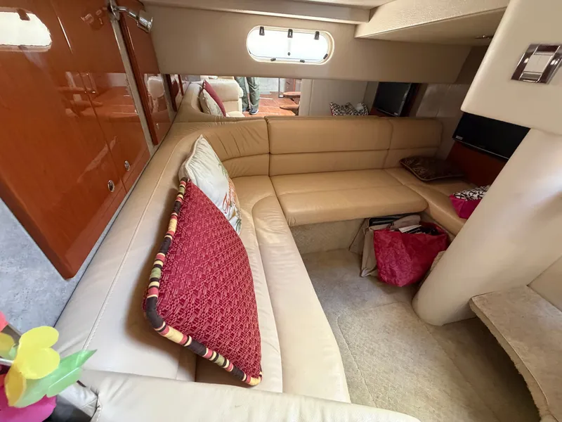 Slide: The Image of Interior of a 2009 Formula 34 Performance Cruiser with beige leather sofa and wood accents. - 13