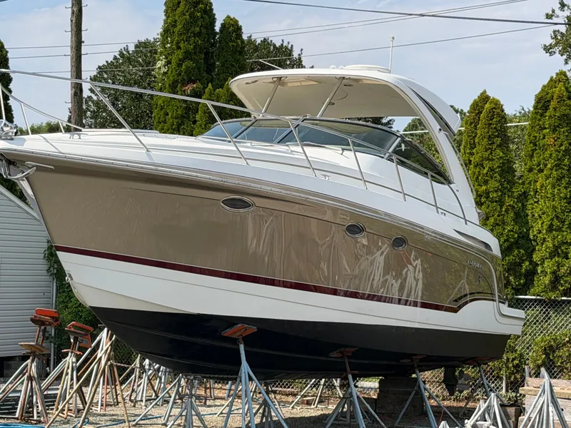 Slide: The Image of 2009 Formula 34 Performance Cruiser on stands, featuring a hardtop and sleek design. - 2