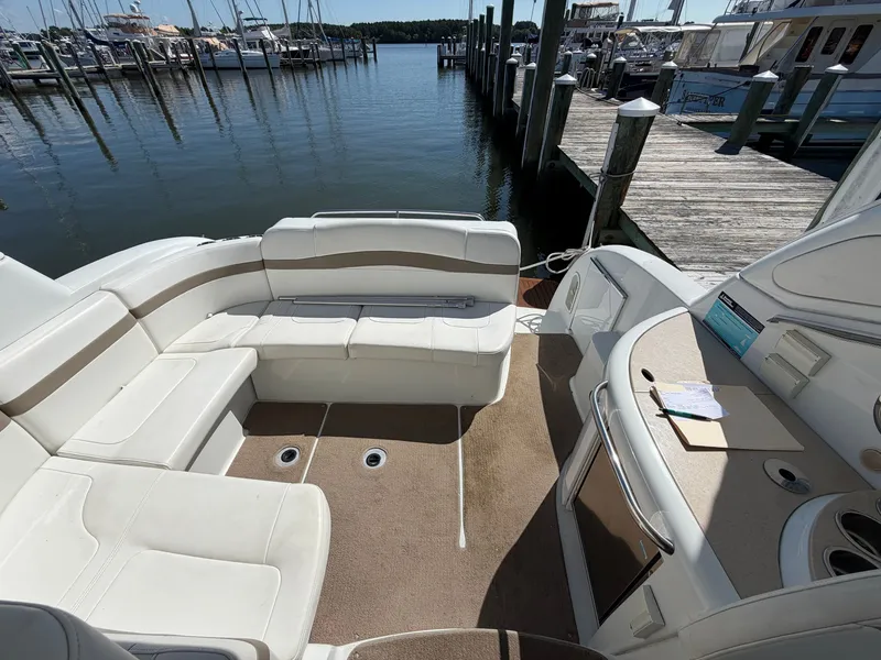 Slide: The Image of The image shows the cockpit of a 2009 Formula 34 Performance Cruiser with white seating and a dock in the background. - 5