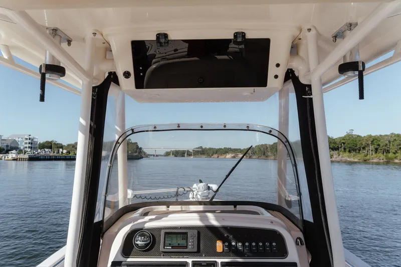 Slide: The Image of 2016 Grady-White Fisherman 257 boat dashboard view on a scenic waterway. - 17