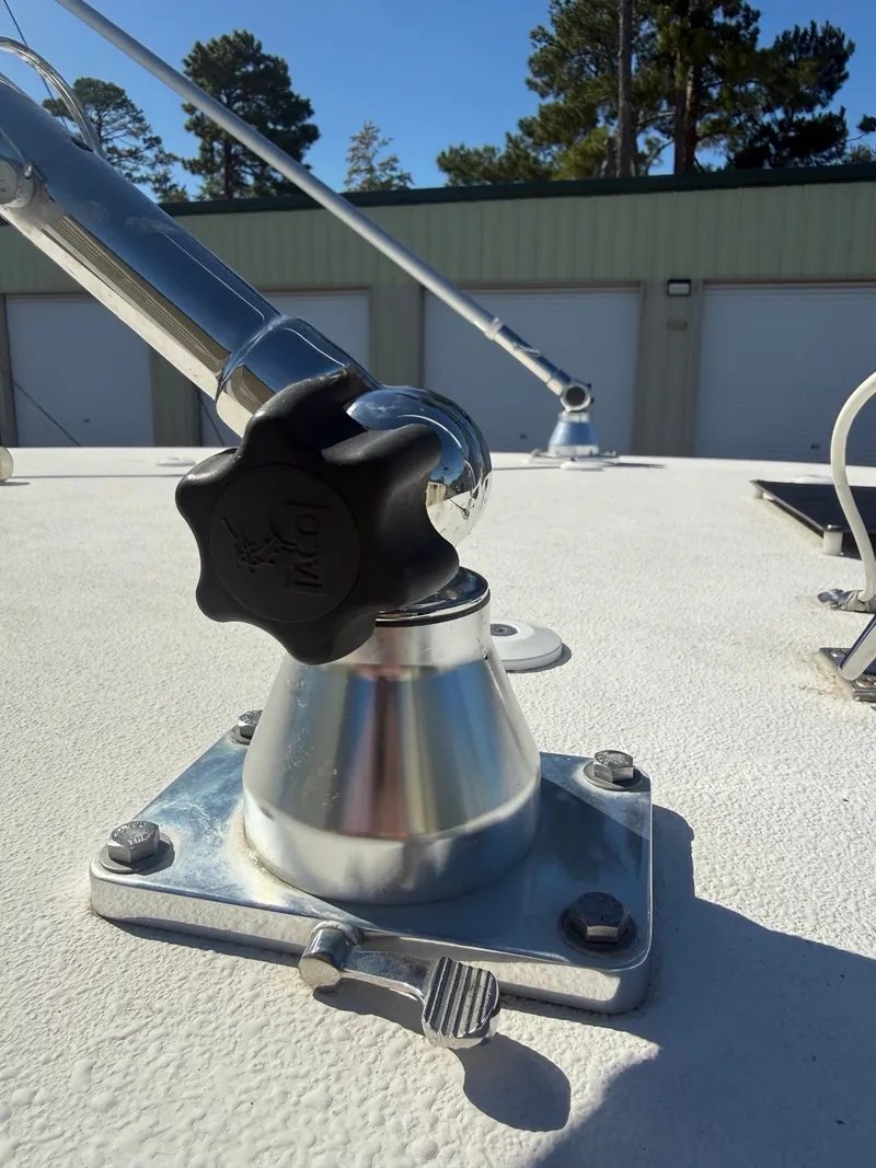 Slide: The Image of Close-up of a boat deck with metal fittings and a lever. - 18