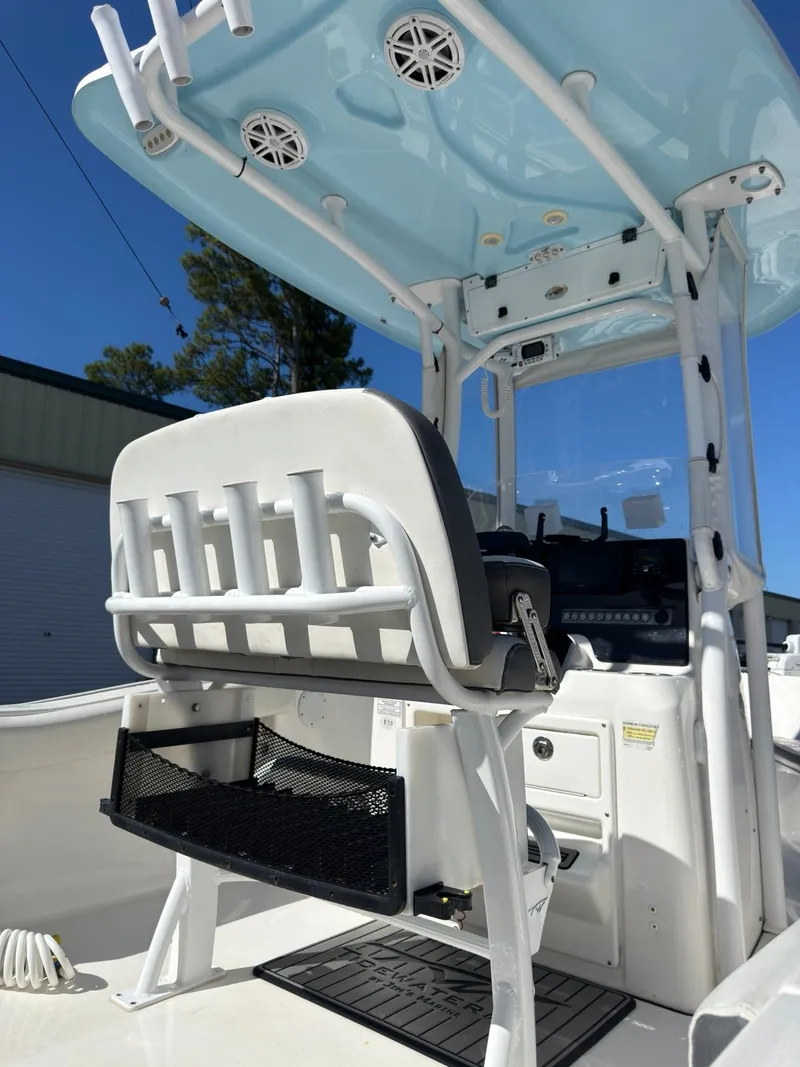 Slide: The Image of The image shows the cockpit of a 2020 Tidewater 210 CC Adventure boat. - 17