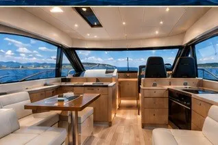 Slide: The Image of Luxurious interior of 2026 Monarch 45 GT yacht with panoramic windows and modern furnishings. - 1