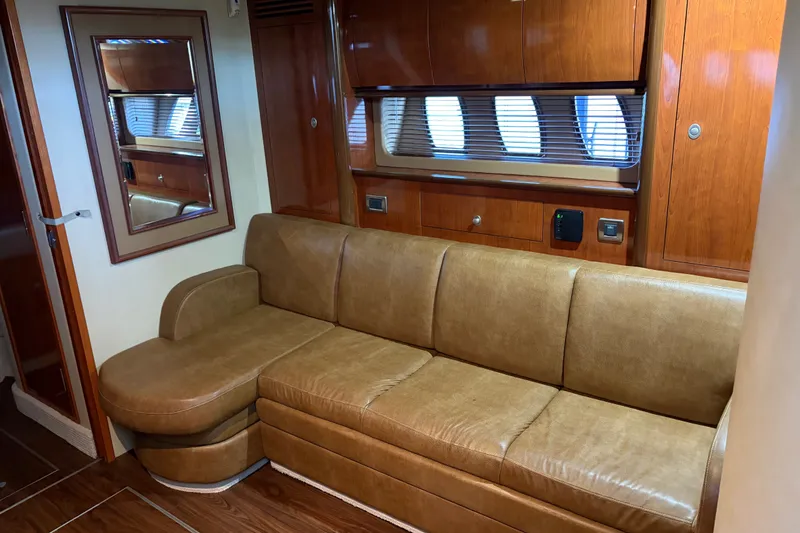 Slide: The Image of Luxurious interior of 2006 Sea Ray 40 Sundancer with leather sofa and wooden cabinetry. - 9
