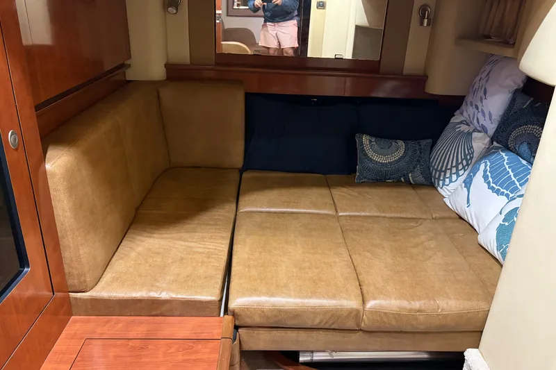 Slide: The Image of Interior of 2006 Sea Ray 40 Sundancer with leather seating and decorative pillows. - 11