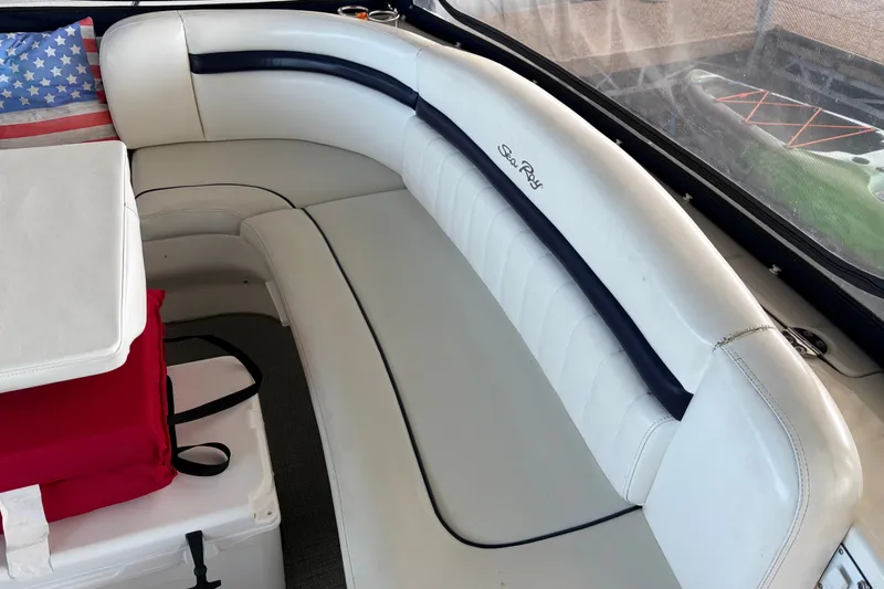 Slide: The Image of Interior seating of a 2006 Sea Ray 40 Sundancer boat with American flag pillow. - 3