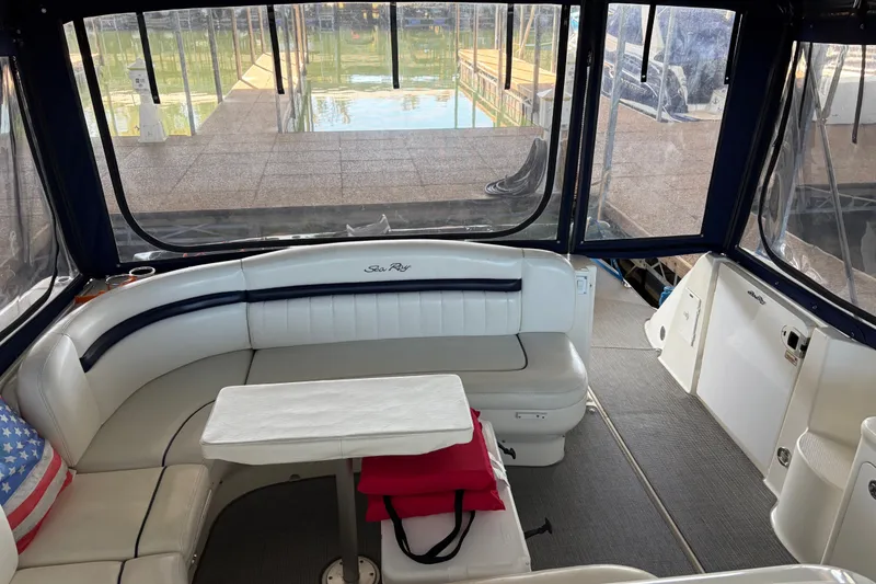 Slide: The Image of Interior of a 2006 Sea Ray 40 Sundancer yacht with seating and table. - 7