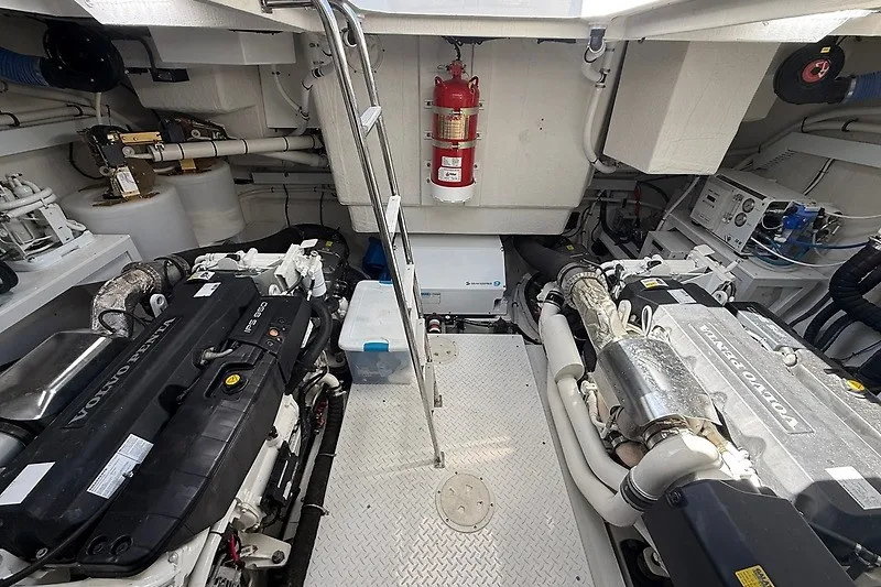 Slide: The Image of Engine room of 2023 Cruisers Yachts 60 Fly, featuring Volvo Penta engines and safety equipment. - 45