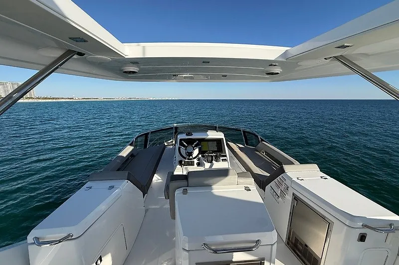 Slide: The Image of 2023 Cruisers Yachts 60 Flybridge, ocean view from helm, modern design. - 42