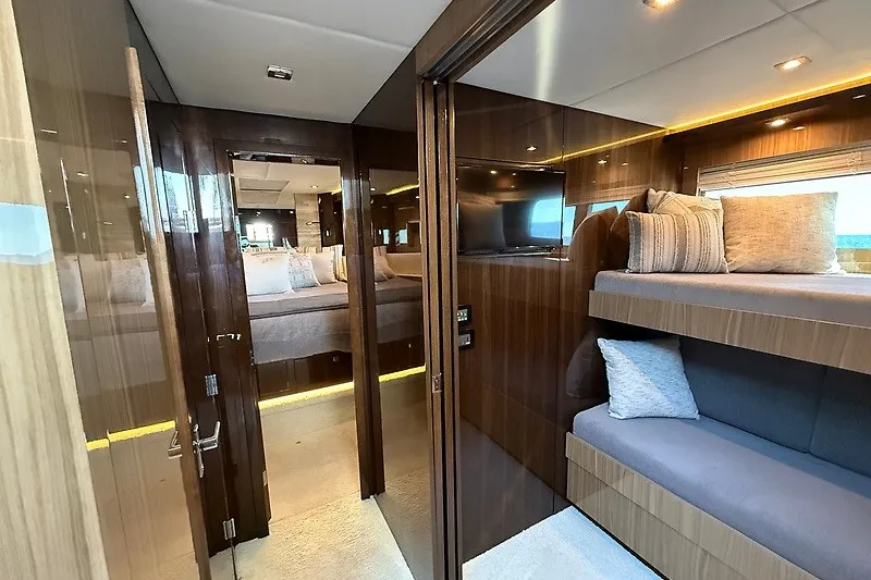 Slide: The Image of Luxurious interior of 2023 Cruisers Yachts 60 Fly with modern wood finishes and cozy seating. - 15