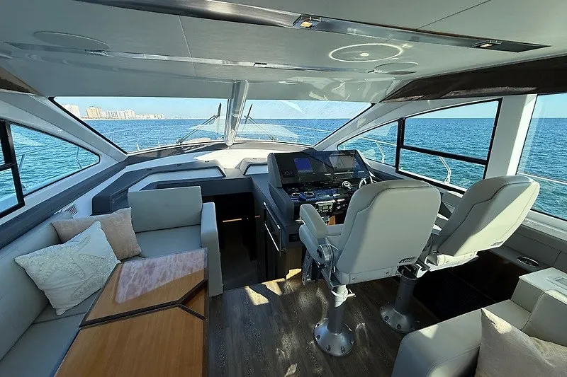 Slide: The Image of Luxurious interior of 2023 Cruisers Yachts 60 Fly with ocean view. - 11
