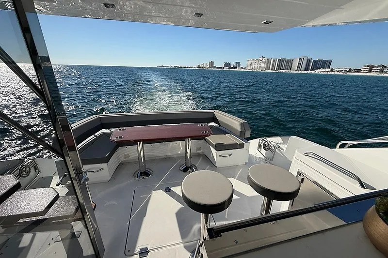 Slide: The Image of Luxurious 2023 Cruisers Yachts 60 Fly with ocean view and elegant seating area. - 31