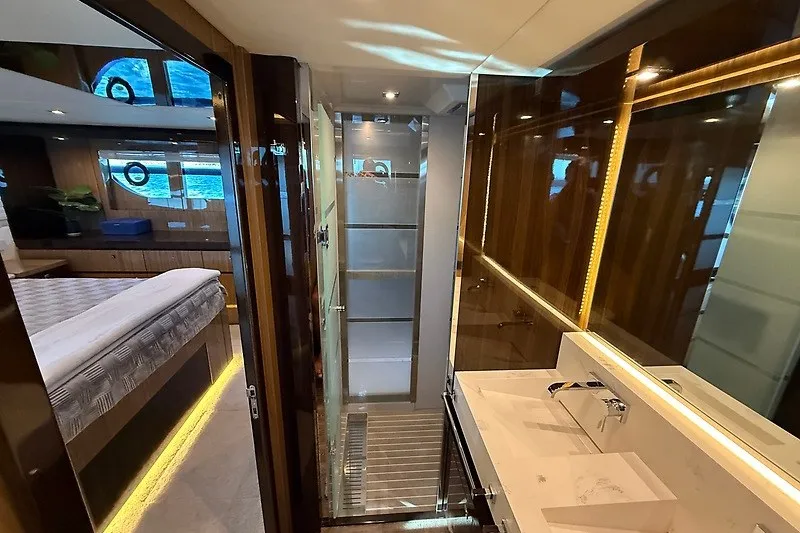 Slide: The Image of Luxurious bathroom interior of 2023 Cruisers Yachts 60 Fly with modern fixtures and elegant design. - 29