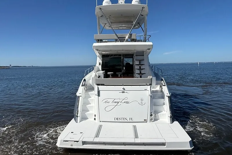 Slide: The Image of 2023 Cruisers Yachts 60 Fly on water, rear view, Destin, FL. - 6