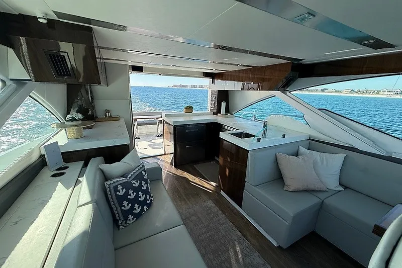 Slide: The Image of Luxurious interior of 2023 Cruisers Yachts 60 Fly with ocean view. - 9