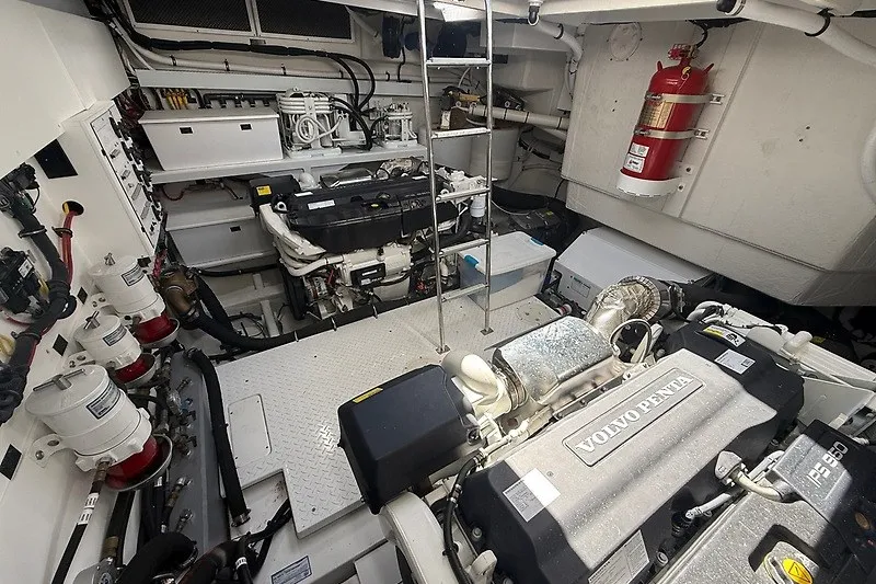 Slide: The Image of Engine room of 2023 Cruisers Yachts 60 Fly, featuring Volvo Penta engines and safety equipment. - 47