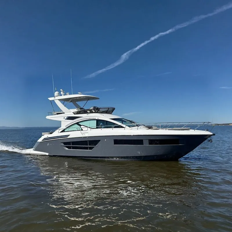 The Image of Cruisers Yachts 60 Fly 2023 on the water, sleek design, two decks, modern styling. - 0