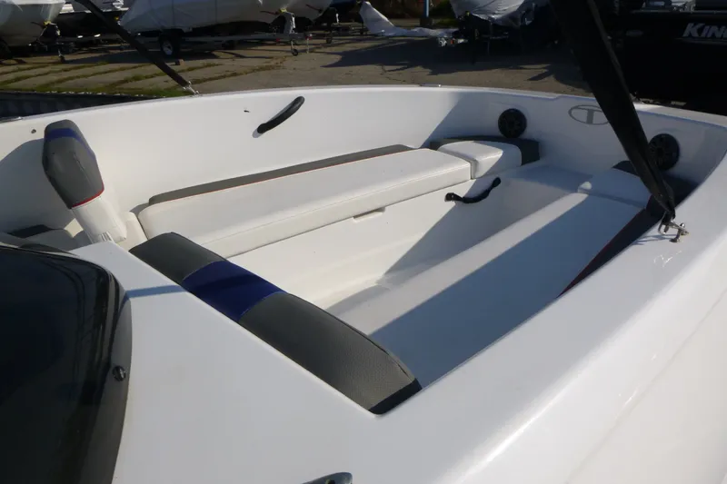 Slide: The Image of 2022 Tahoe T18 boat interior with white seating and black accents. - 15
