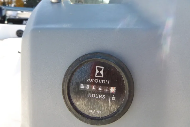 Slide: The Image of Hour meter on 2022 Tahoe T18 boat, displaying 61.1 hours. - 19