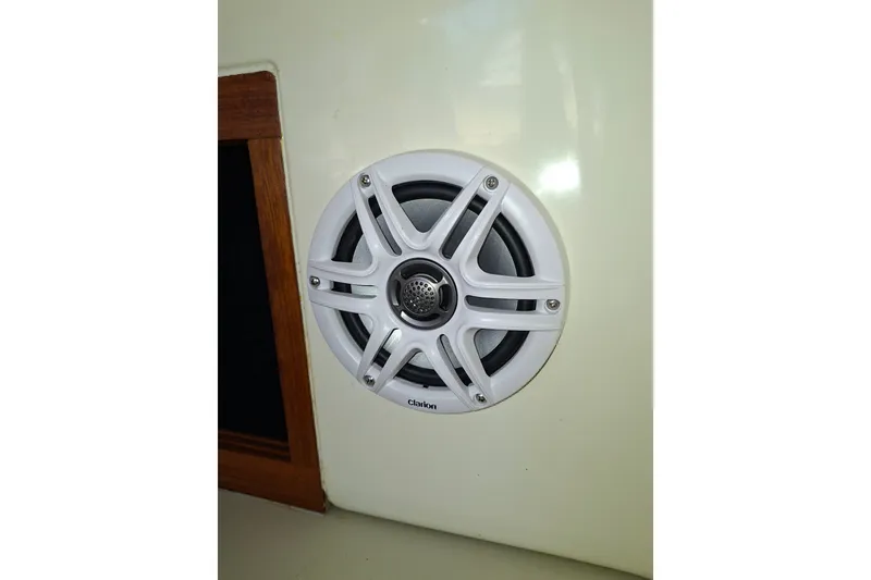 Slide: The Image of White Clarion speaker installed on a 1992 Luhrs Tournament 300 boat interior. - 26
