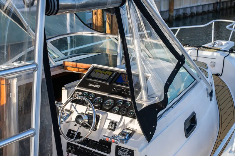 Slide: The Image of 1992 Luhrs Tournament 300 boat helm with steering wheel and instrument panel. - 15