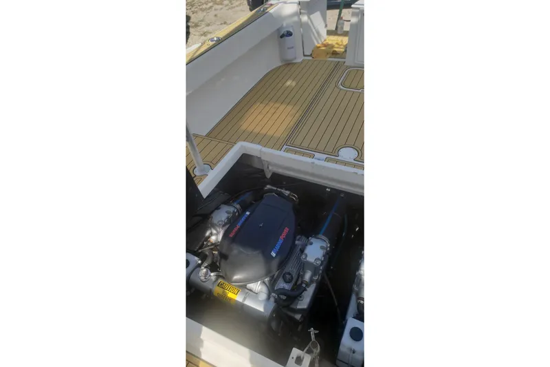 Slide: The Image of 1992 Luhrs Tournament 300 boat engine and deck view, showcasing clean design and functionality. - 33