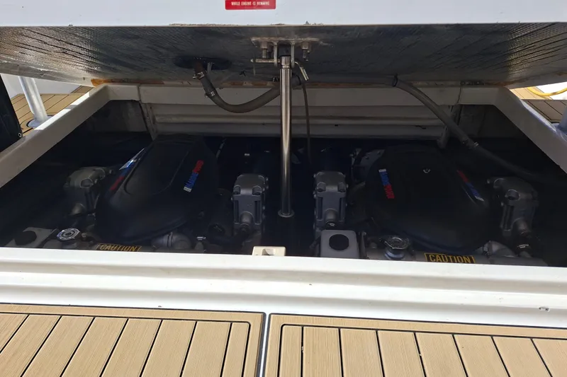 Slide: The Image of 1992 Luhrs Tournament 300 engine compartment with twin engines visible. - 32