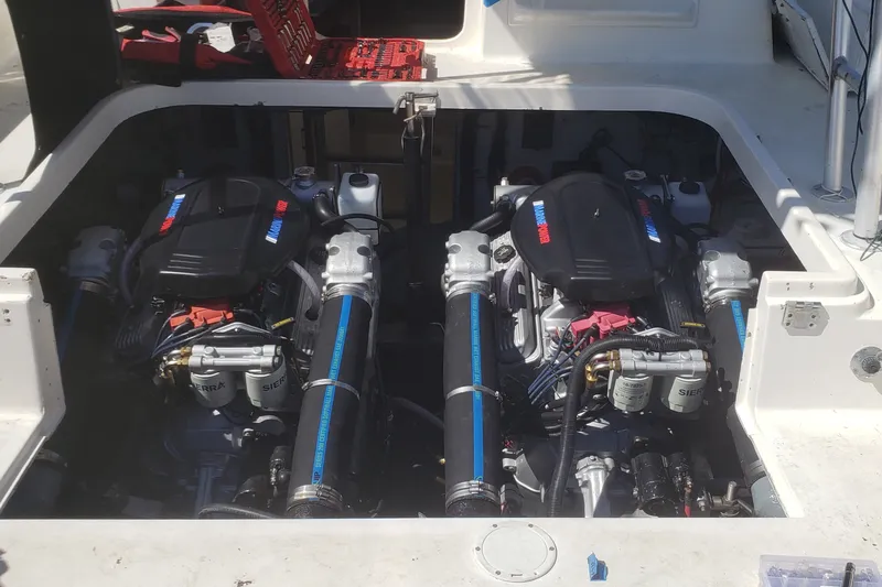Slide: The Image of Twin engines in a 1992 Luhrs Tournament 300 boat, showcasing detailed mechanics. - 34