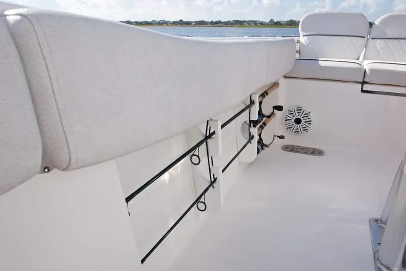 Slide: The Image of Manufacturer Provided Image: Interior view of 2022 Sea Fox 228 Commander boat with rod holders and seating. - 15