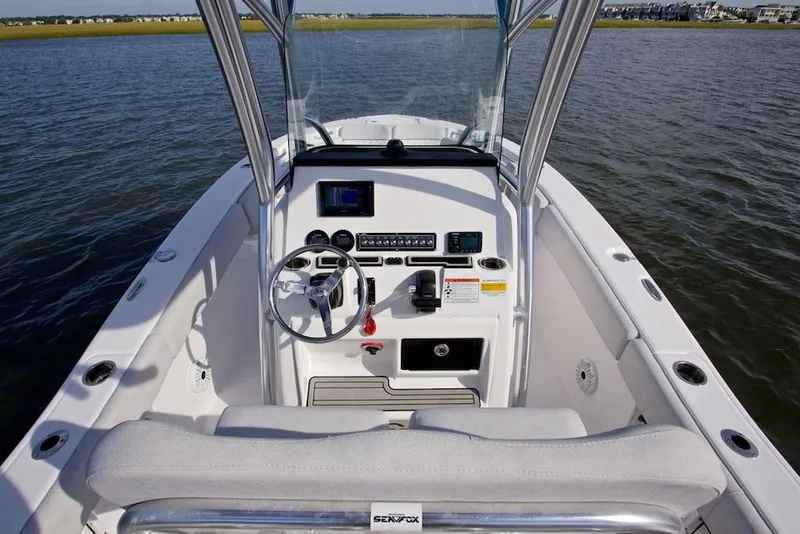 Slide: The Image of Manufacturer Provided Image: 2022 Sea Fox 228 Commander boat console with steering wheel and navigation equipment. - 11