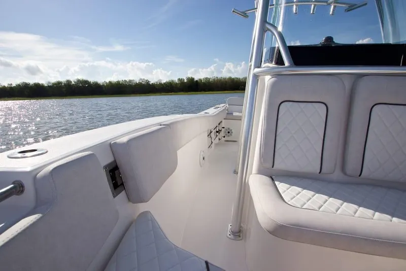 Slide: The Image of Manufacturer Provided Image: 2022 Sea Fox 228 Commander boat interior with cushioned seating on a sunny day. - 10