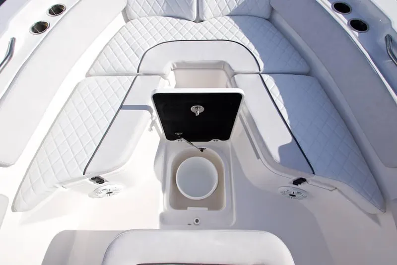 Slide: The Image of Manufacturer Provided Image: 2022 Sea Fox 228 Commander boat interior with white cushioned seating and storage compartments. - 8