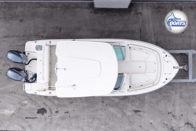 Slide: The Image of Overhead view of 2019 Robalo R247 Dual Console boat with twin engines. - 13