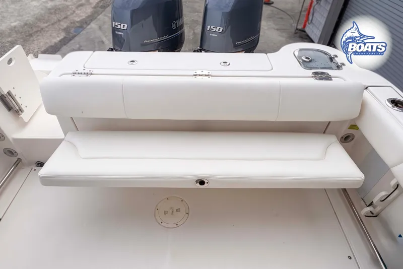 Slide: The Image of 2019 Robalo R247 Dual Console boat with Yamaha engines and cushioned seating. - 10