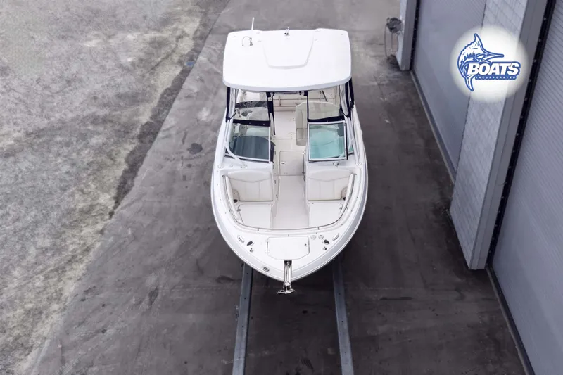 Slide: The Image of 2019 Robalo R247 Dual Console boat in storage, top view. - 2