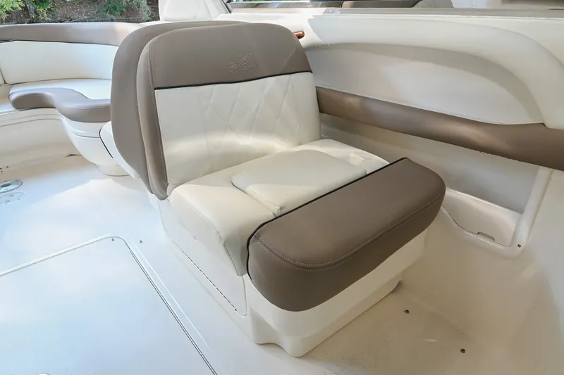 Slide: The Image of 2001 Sea Ray 290 Select EX boat interior with beige and white seating. - 6