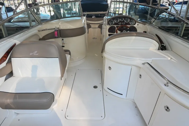 Slide: The Image of Interior of a 2001 Sea Ray 290 Select EX boat with seating and dashboard. - 4