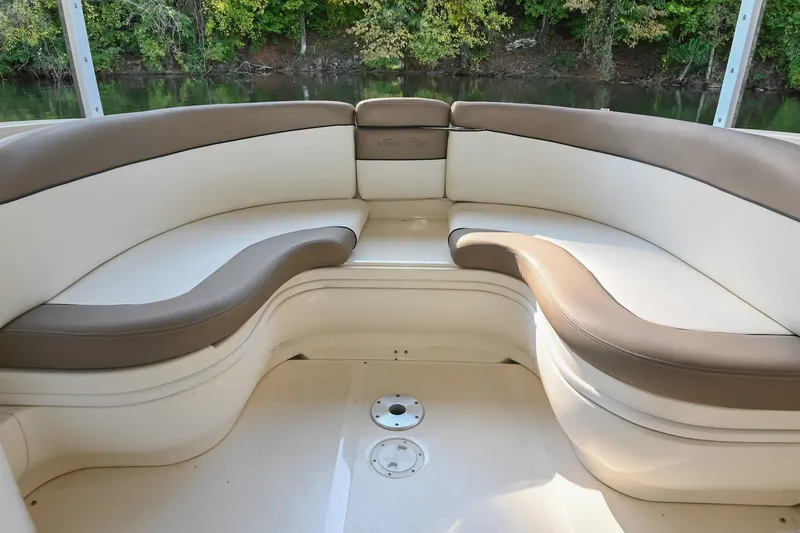 Slide: The Image of Luxurious seating area on a 2001 Sea Ray 290 Select EX boat, with scenic river backdrop. - 5
