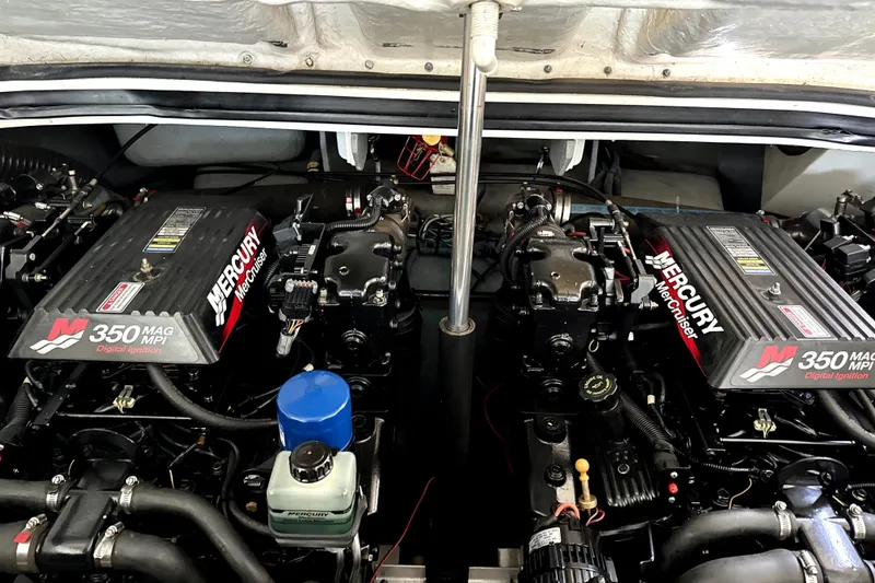 Slide: The Image of Twin Mercury MerCruiser 350 MAG MPI engines in a 2001 Sea Ray 290 Select EX boat. - 13