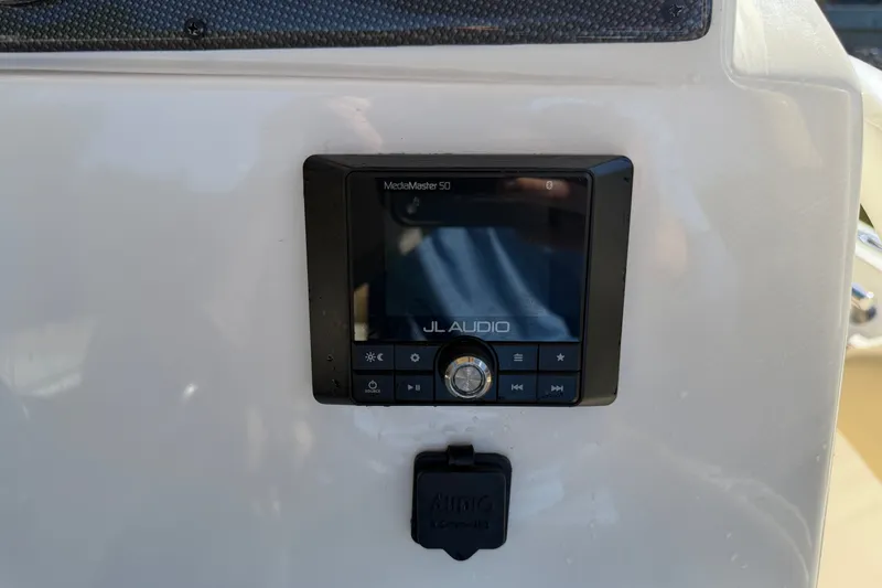 Slide: The Image of JL Audio MediaMaster 50 installed on 2022 Pioneer 202 Islander boat dashboard. - 13
