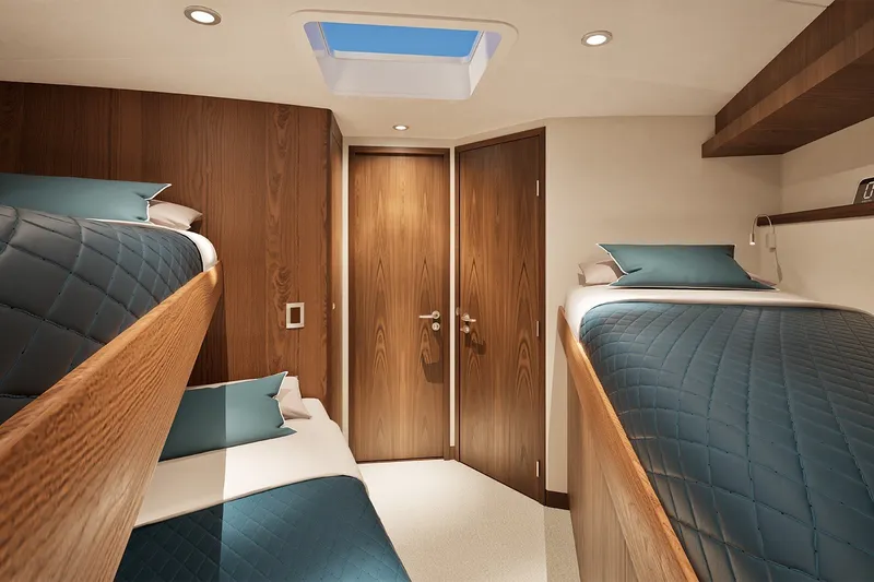 Slide: The Image of Luxurious cabin interior of 2026 Hatteras 77 Convertible yacht with wooden finishes and skylight. - 13