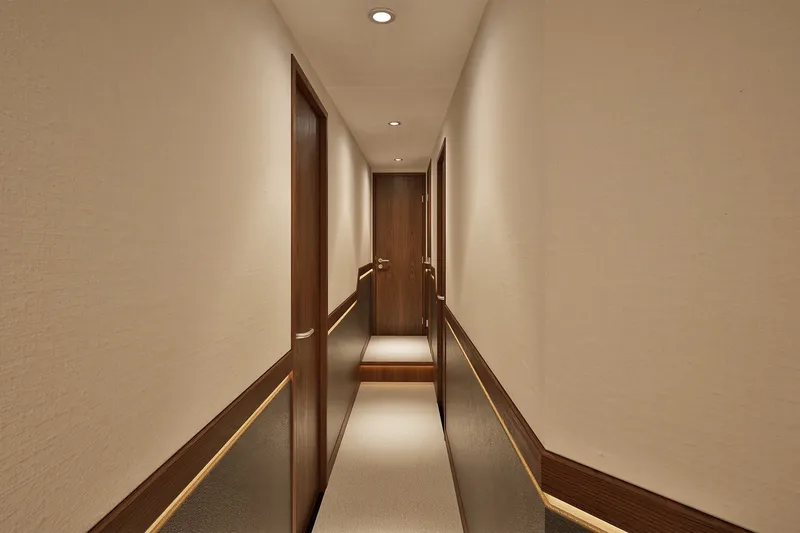 Slide: The Image of Luxurious hallway interior of 2026 Hatteras 77 Convertible yacht. - 14