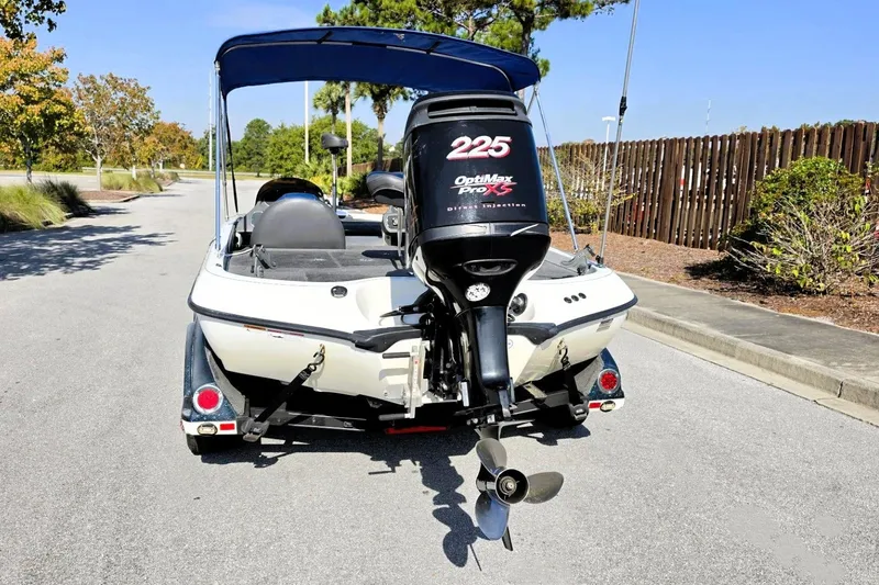 Slide: The Image of 2009 Ranger 208 VX boat with OptiMax Pro XS engine, parked on a sunny day. - 16
