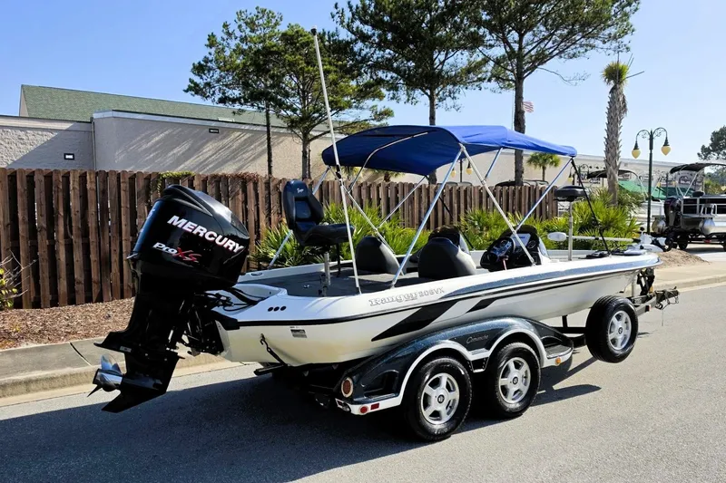 Slide: The Image of 2009 Ranger 208 VX boat with Mercury Pro XS engine, parked on a trailer. - 10